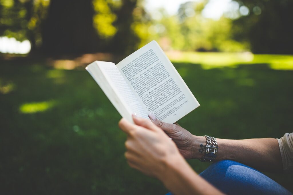 Someone reading a book in the park